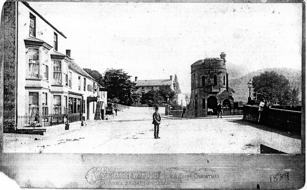 A photograph of Bridge End taken in 1889. The steps leading to the upper floors of the Bridge End Hotel can be seen