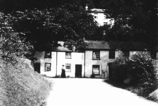 The Britannia Inn in the early 20th century, when the road ran past the door